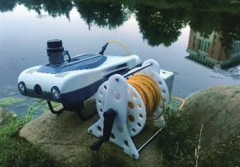 PX-MiniROV and tether reel in a second crop of the same Pengpai Ocean brochure photograph, illustrating transport and cable scope to confirm.