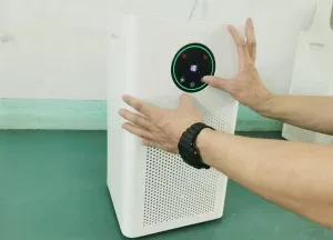 A person manually handling the controls of a purification product in the original sample-checking image