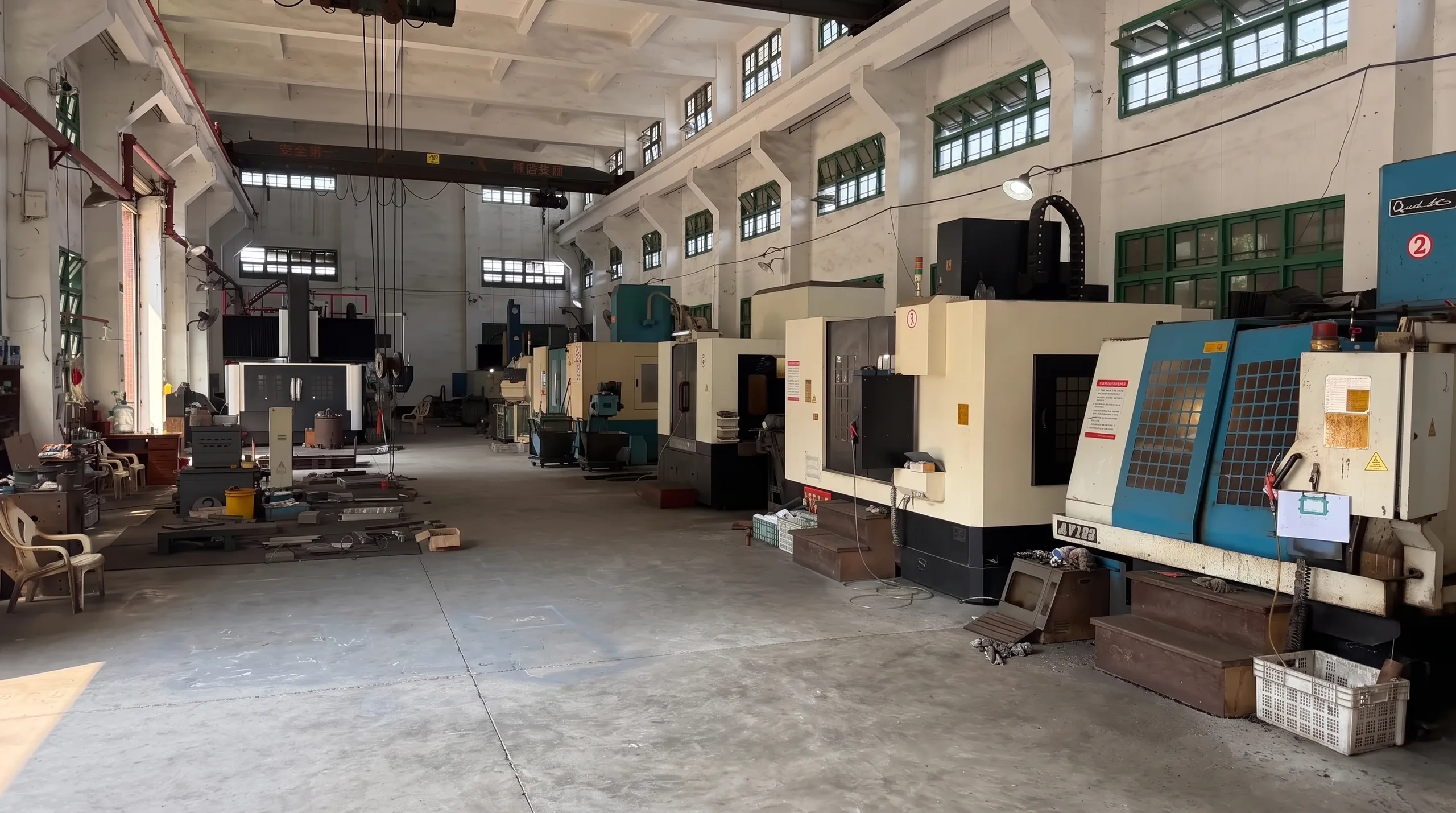 Machining equipment along the aisle in Wanjiada’s workshop; retouched photograph