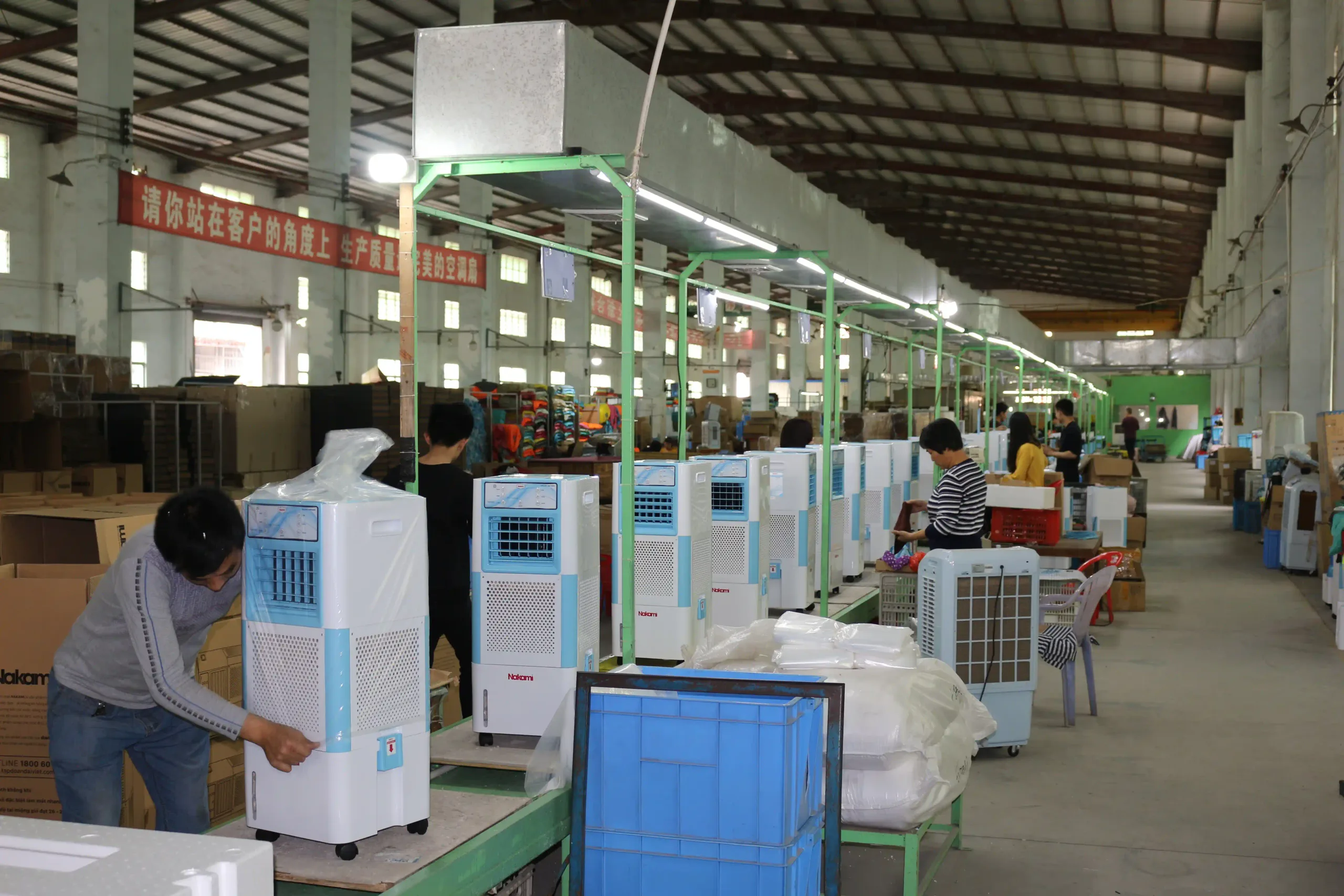 Workers and cooler units on another Wanjiada assembly line view